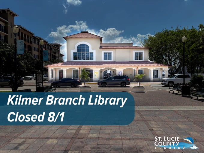 Front view of Kilmer Branch Library with cars parked outside under a partly cloudy sky in St. Lucie County, Florida.