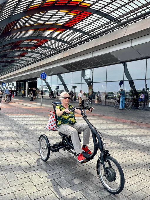 People of all ages and abilities ride tricycles for transportation on the streets of the Netherlands.