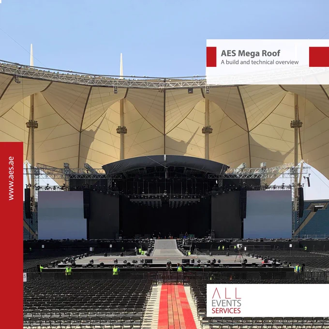 🏟️ The AES Mega Roof stands as a monumental achievement in event staging, epitomizing cutting-edge engineering and design. This colossal structure, measuring 47 meters in width and 21.5 meters in height, is distinguished by its unique arched roof, setting new benchmarks for stage dimensions, load-bearing capacity, and installation versatility.

Designed to accommodate the most demanding global productions, the AES Mega Roof offers a generous performance area of 26.9 meters by 21.5 meters, with additional extensions available. The stage floor height starts at 1.5 meters, providing a clearance of up to 18.6 meters, and boasts an impressive roof load capacity of up to 60,000 kilograms, evenly distributed.

This stage has been the platform of choice for numerous high-profile events, including performances by renowned artists such as Iron Maiden. Its distinctive arched design not only enhances the visual appeal but also ensures optimal acoustics and audience engagement.

