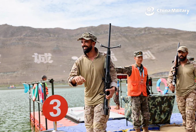 Photo shows a Tunisian contestant smiling with satisfaction after completing in the "Waterborne Sniping via Boats" event of the Sharp Blade 2025 International Sniper Competition on the morning of July 16, 2025.