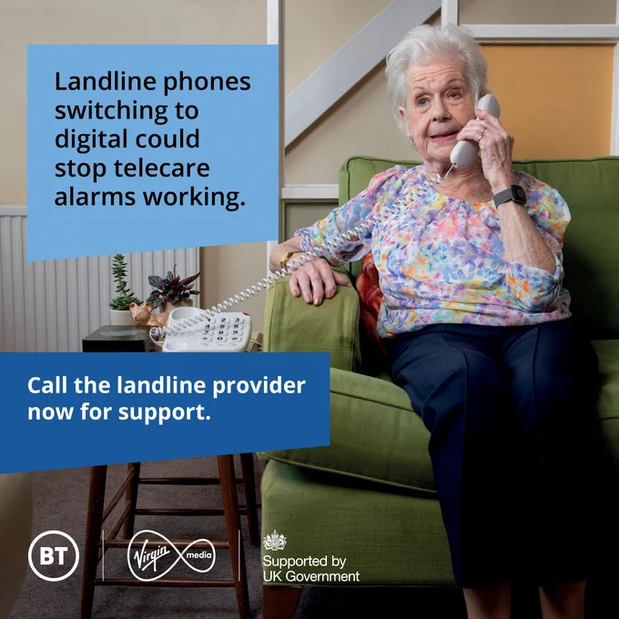 An elderly woman sits on a green sofa holding a landline phone to her ear. The text on the image reads, "Landline phones switching to digital could stop telecare alarms working. Call the landline provider now for support." A small table beside her holds a telephone with large buttons. Logos at the bottom include BT, Virgin Media, and "Supported by UK Government."
