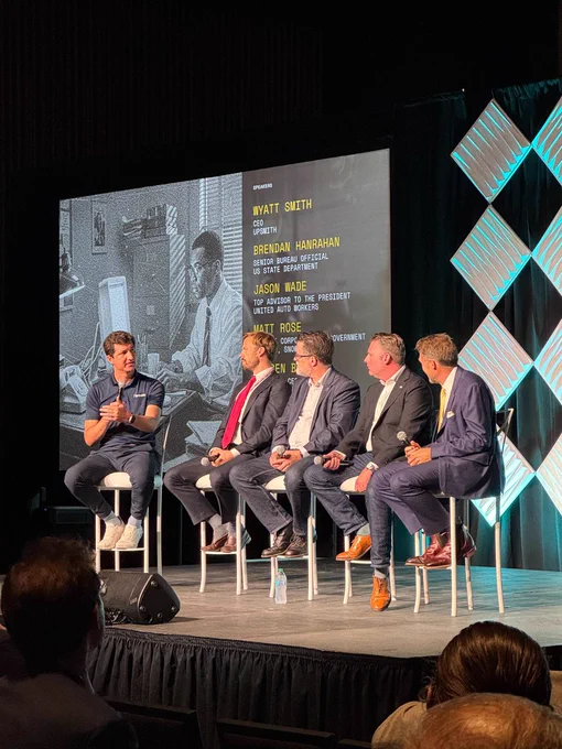 Pictured from left to right: Wyatt Smith, CEO and founder of UpSmith; Jason Wade, UAW International Representative; Matt Rose, Head of Corporate and Government Affairs for Snowflake; JoeBen Bivert, CEO and founder of Joby Aviation. The picture was taken at the Reindustrialize 2025 in Detroit, Michigan.