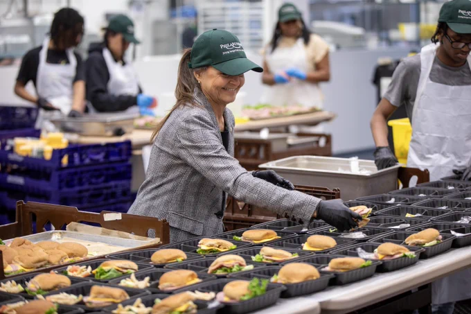 Secretary Walker, Philabundance staff, and local students pack meals and label boxes as part of Philabundance's LunchBox 2025 program.