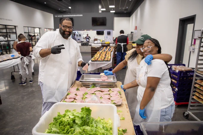 Philabundance staff and local students pack meals and label boxes as part of Philabundance's LunchBox 2025 program.