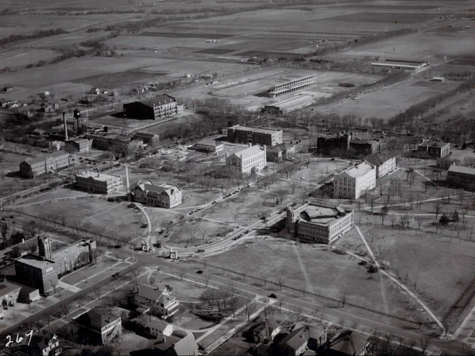 This aerial photograph of the campus looking toward the southeast was made in 1927. In the thirty-five years since the first University of Oklahoma building opened, the campus had grown to more than twenty buildings. Several buildings, such as the Field House, Memorial Stadium, the Liberal Studies Building, the Engineering Building, and the Pharmacy Building, had been completed recently, and a student union and library were scheduled for construction in the near future.

