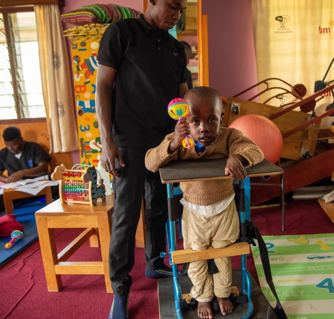 Child standing in a standing frame