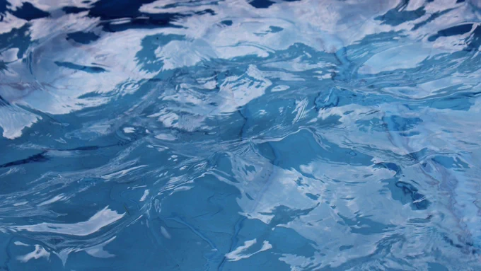 Water is pictured in a swimming pool.