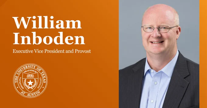 Portrait of William Inboden, Executive Vice President and Provost at the University of Texas at Austin, smiling and standing to the right with the university's logo on the left.