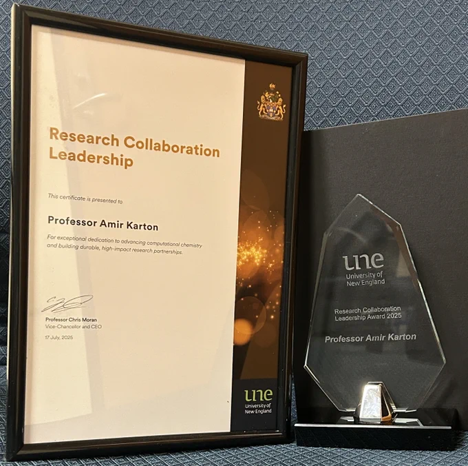 The certificate reads “Research Collaboration Leadership – Professor Amir Karton – For exceptional dedication to advancing computational chemistry and building durable, high-impact research partnerships.” The award is from the University of New England (UNE), dated 17 July 2025.
