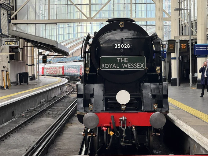 The clan line locomotive ahead of the Inspiration