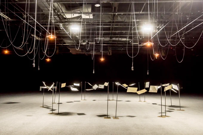 Microphones hanging from the ceiling in a studio 