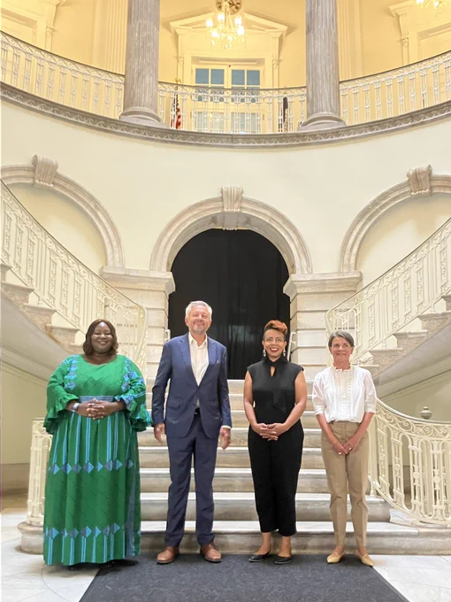 Photo of International and Cultural Affairs Commissioners and Consul Generals of Finland and Denmark in the City Hall rotunda. 