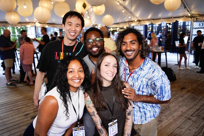 Group picture consisting of richard, wayne, and a man in the back, Lidia and Hazel in the front