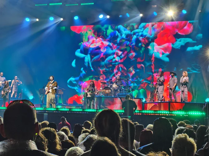 Hozier performs in front of a 10 piece band