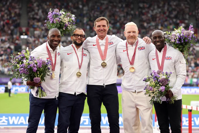Five men stood on the podium with gold medals