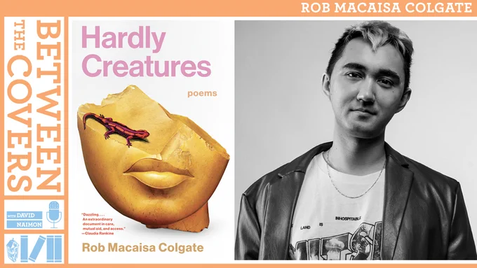 Poet Rob Macaisa Colgate in a t-shirt and leather jacket next to the cover of his poetry collection which shows the bottom half of a bust of a human head with a blind salamander sitting atop where the head is broken. 