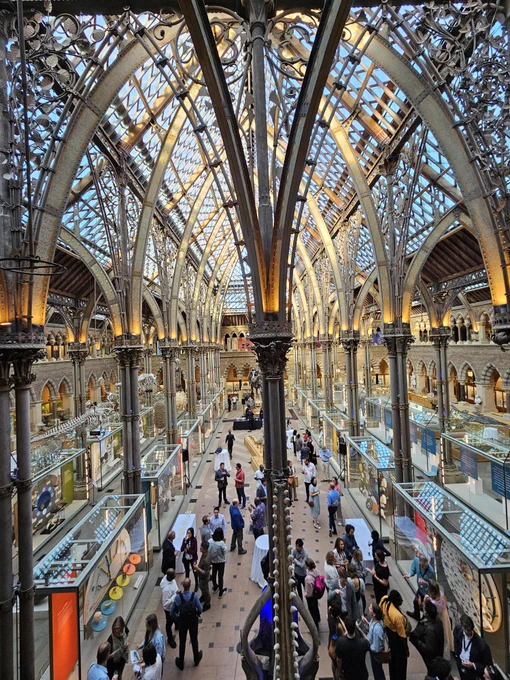 Photo of an indoor space with multiple people standing