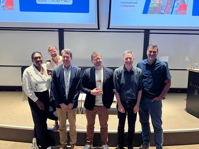 Photo of 6 people standing