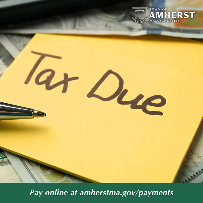 Yellow sticky note that says "Taxes Due" with money in the background. 
