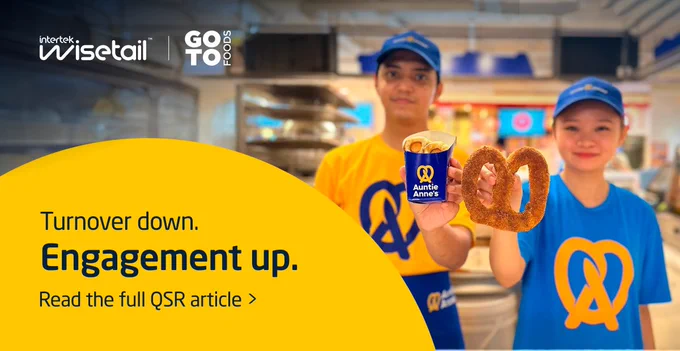 Two employees in Auntie Anne's uniforms holding a pretzel and a cup of beverage, standing in front of a blurry food court backdrop with text about decreasing turnover and increasing engagement.