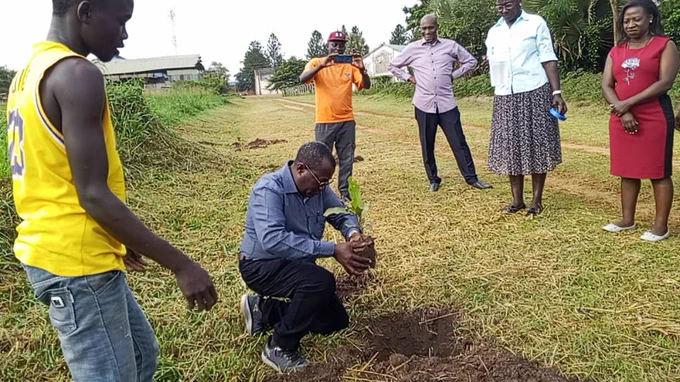  Dr. Baguma, E.D ASERECA planting a Shea tree which shall be natured for the benefit of the future generations.