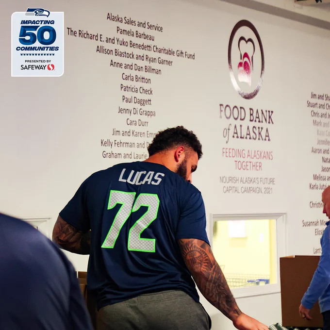 Seahawks Abraham Lucas at Foot Bank Of Alaska Community Event.
