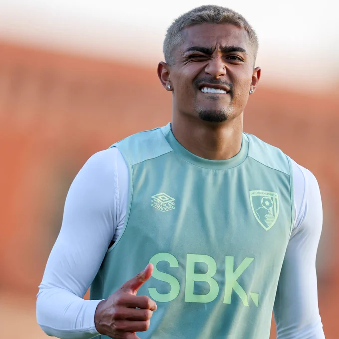Julian Araujo winks at camera as he returns to AFC Bournemouth training.