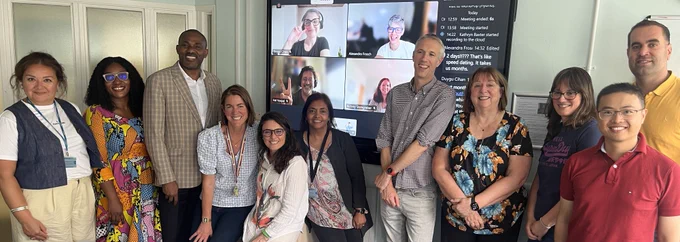 Photo of Professor Dame Wendy Hall, Professor Andy Tatem and teams from WorldPop and Data Science Nigeria