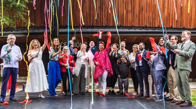 Cultural leaders and elected officials cut the ribbon on The Delacorte Theater. 
