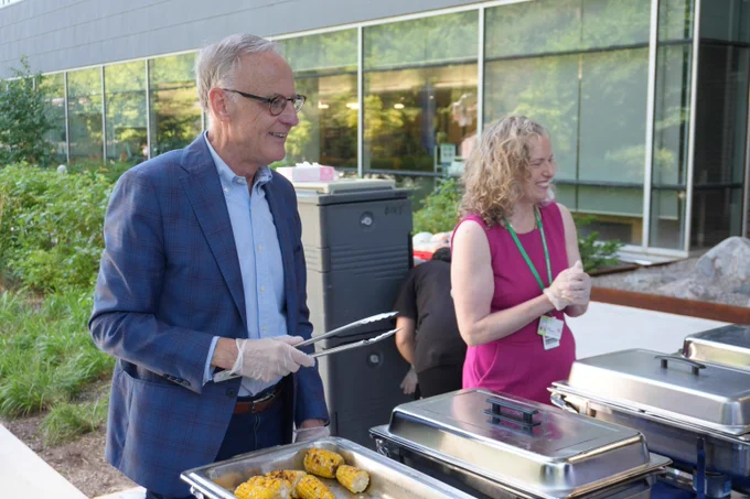 MP Rob Oliphant and Holland Bloorview CEO Julia Hanigsberg serve lunch together at Holland Bloorview.