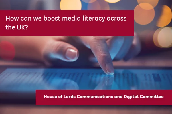 Person scrolling on a tablet. Quote: "How can we boost media literacy across the UK?"