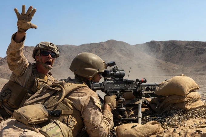 U.S. Marines with 2nd Battalion, 8th Marine Regiment, 2nd Marine Division, provide suppressive fire during Service Level Training Exercise 4-25, at Range 410A, Marine Corps Air Ground Combat Center, Twentynine Palms, California, July 16, 2025. SLTE 4-25 is designed to be a challenging, realistic training environment that produces combat-ready forces capable of operating as an integrated Marine Air Ground Task Force. (U.S. Marine Corps photo by Lance Cpl. Jozef Majewski)
