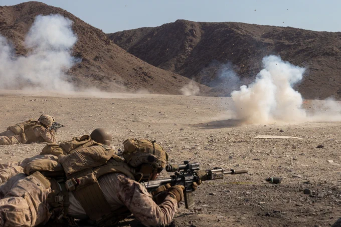 U.S. Marines with 2nd Battalion, 8th Marine Regiment, 2nd Marine Division, provide suppressive fire during Service Level Training Exercise 4-25, at Range 410A, Marine Corps Air Ground Combat Center, Twentynine Palms, California, July 16, 2025. SLTE 4-25 is designed to be a challenging, realistic training environment that produces combat-ready forces capable of operating as an integrated Marine Air Ground Task Force. (U.S. Marine Corps photo by Lance Cpl. Jozef Majewski)
