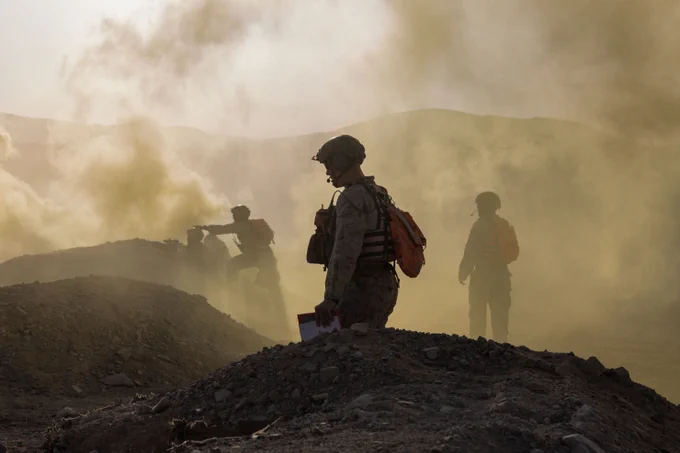 U.S. Marines with Tactical Training and Exercise Control Group, Marine Air Ground Task Force Training Command, Marine Corps Air Ground Combat Center, oversee training during platoon attacks as part of Service Level Training Exercise 4-25, at Range 410A, MCAGCC, Twentynine Palms, California, July 16, 2025. SLTE 4-25 is designed to be a challenging, realistic training environment that produces combat-ready forces capable of operating as an integrated Marine Air Ground Task Force. (U.S. Marine Corps photo by Lance Cpl. Jozef Majewski)