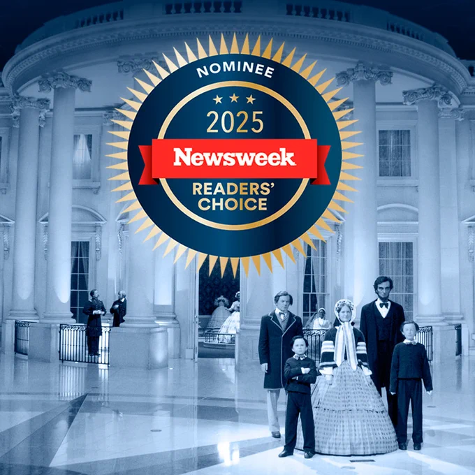 Badge reading ‘Nominee 2025 Newsweek Readers’ Choice’ over a background of the Abraham Lincoln Presidential Museum’s White House exhibit, featuring life-size figures of Abraham Lincoln, Mary Lincoln, and their children.