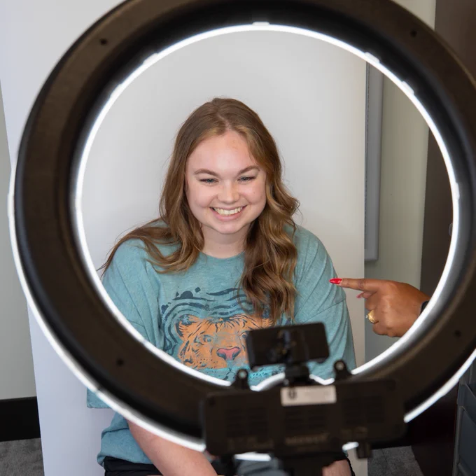A female student having her ID photo taken at Heart Start at Henderson State University on July 25, 2025. 