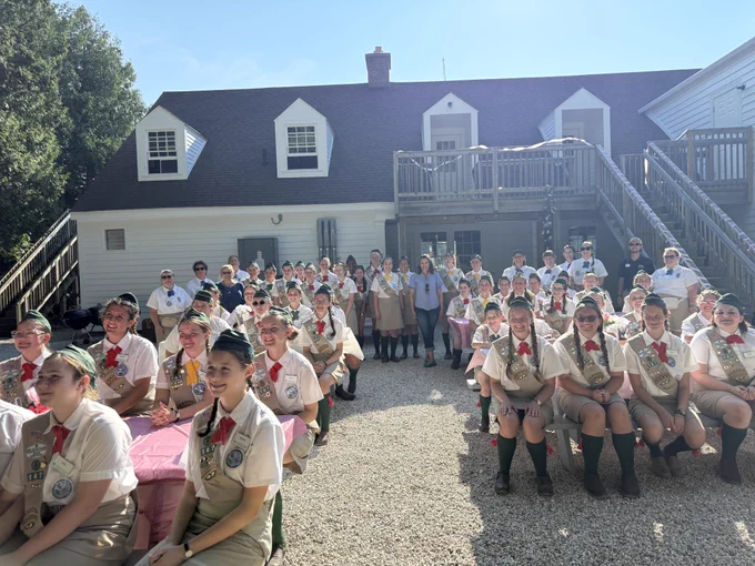 Gov. Whitmer takes photo with Girl Scouts in the Mackinac Island Scout Service Program.
