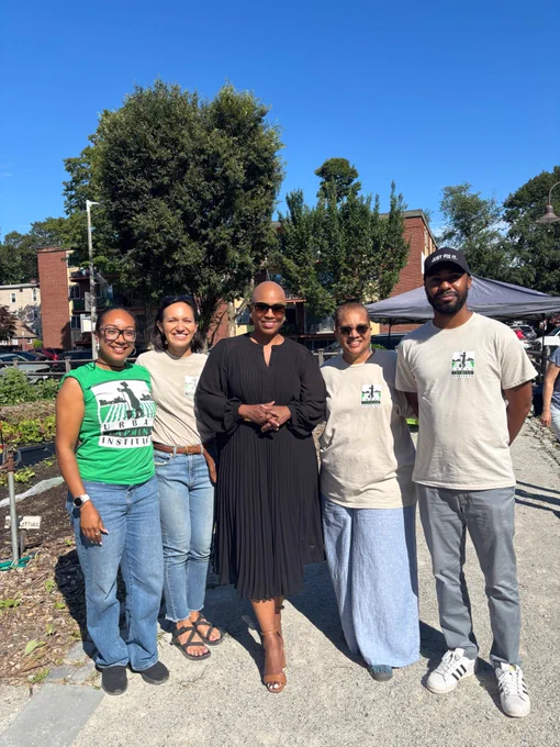 Rep. Ayanna Pressley poses for a photo with Urban Farming Institute leaders in Mattapan. 