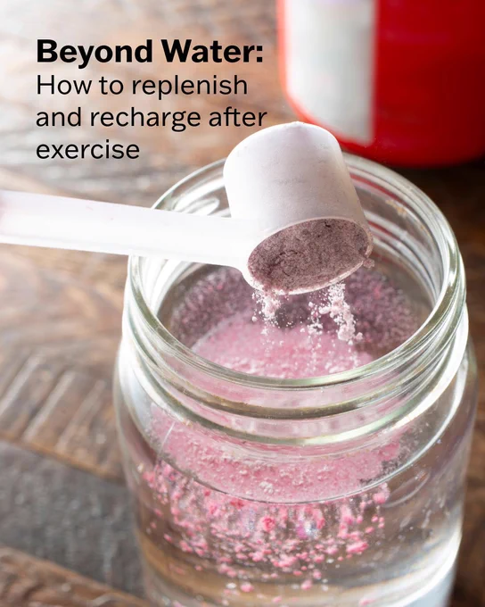Powdered electrolyte mix is poured into a glass of water. The text says, "Beyond Water: How to replenish and recharge after exercise."