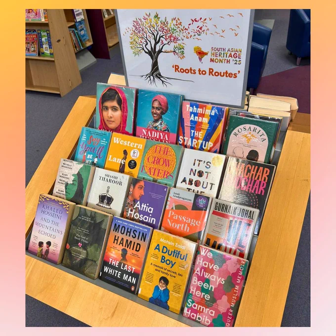 Orange and pink background with a photograph of the South Asian Heritage Month display at Farnham Library with a selection of books by South Asian authors. 

The poster above the display reads: 
South Asian Heritage Month '25 
'Roots to Routes' 
