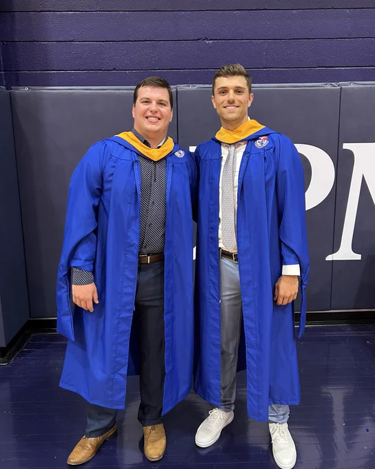 Ethan and Ben smiling at graduation