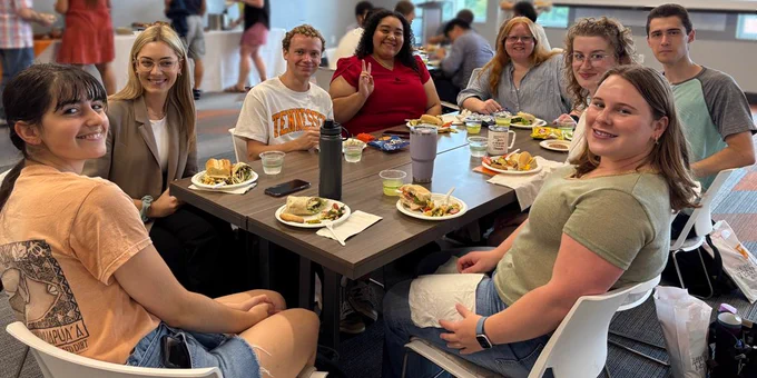 New physics graduate students gathered around a table at the fall 2025 welcome lunch