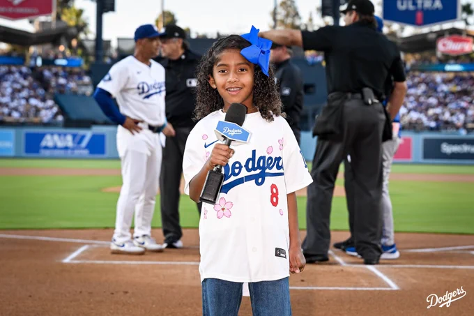 Capri Bryant smiles before doing “It’s Time for Dodger Baseball.”