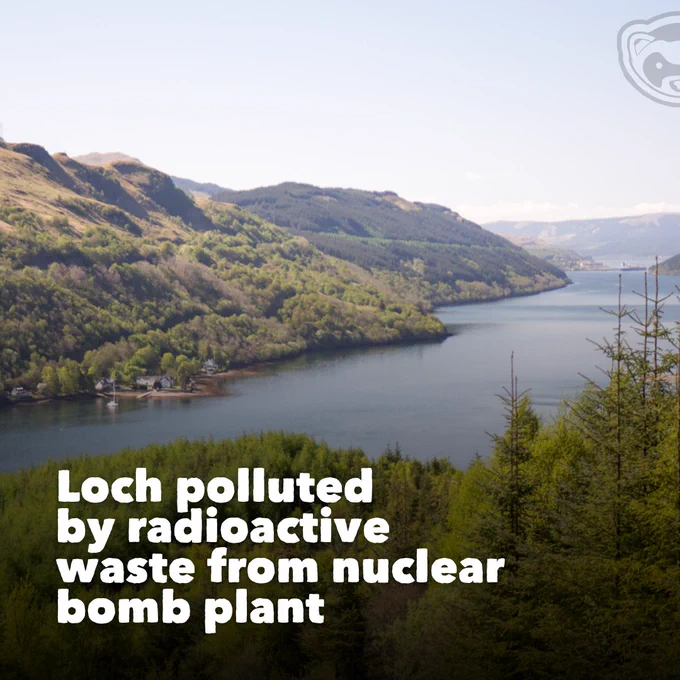 View of Loch Long surrounded by wooded hills under a clear sky. Overlaid text reads: “Loch polluted by radioactive waste from nuclear bomb plant.”