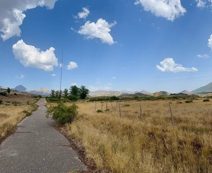An abandoned roadway in Babia y Luna.. Mountains in the distance.