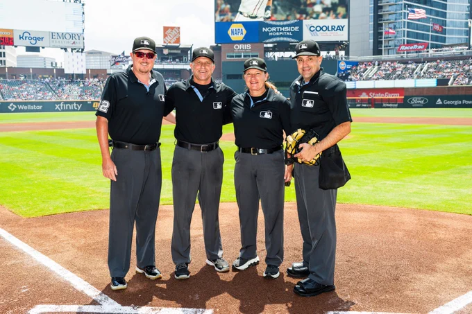 Today's umpire crew poses for a picture at home plate before today's game. 