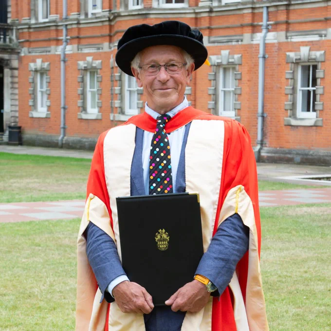 Chris Hines MBE in graduation gown having been awarded an honorary degree.

