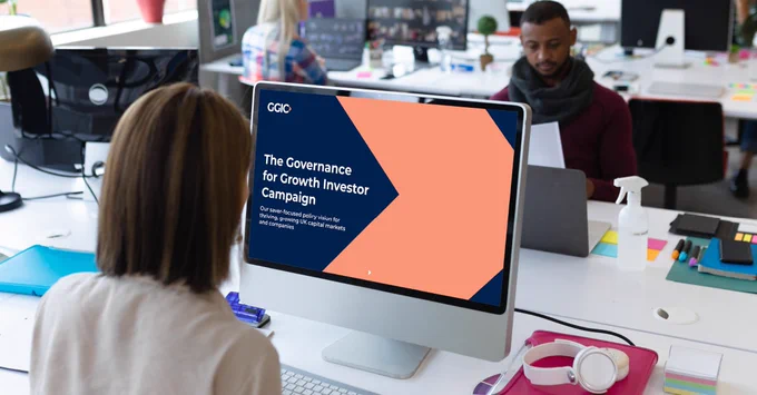 Image shows a person reading the GGIC policy vision on their computer screen in an office environment.