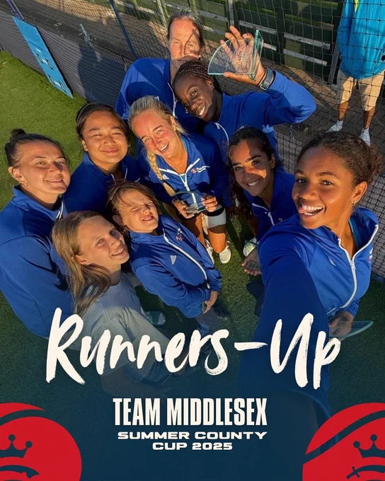 Women’s team selfie with trophies