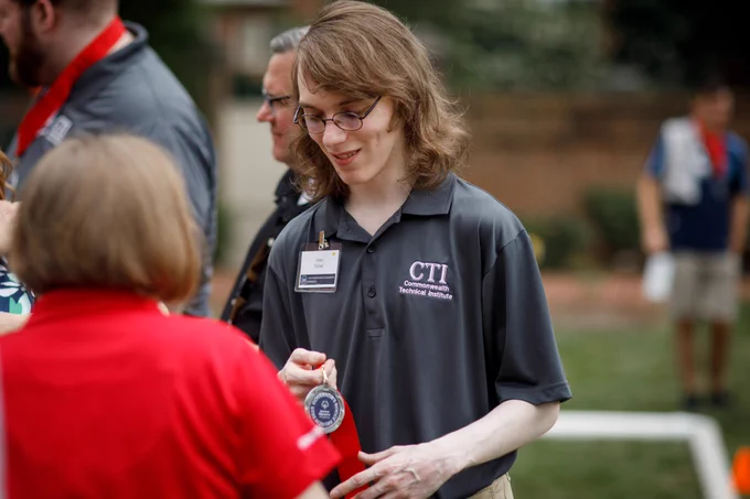 Team OVR participant accepting a medal at the Special Olympics Pennsylvania Bocce Ball Tournament at the Governor’s Residence.